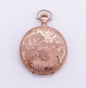 Antique Gold GF Bird and Flower Motif Ladies Tavennes Pendant Watch: This is an antique gold filled ladies pendant watch from the Tavannes Watch Co. The case features birds and flowers. It is 2" long including the bow and the case diameter is 1 3/8". 