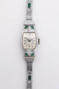 Antique Art Deco 14K White Gold Filigree Diamond Emerald Bulova Ladies 15J Wristwatch: This is an antique Swiss ladies Bulova 15 jewel wristwatch featuring an Art Deco 14K white gold filigree case accented by single cut diamonds and emeralds. The filigree band is not gold. The case is