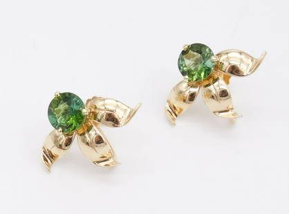 Vintage 14K Gold Green Tourmaline Gemstone Botanical Motif Earrings: This is a vintage pair of 14K gold earrings featuring a botanical motif with large green Tourmaline gemstones at the center. Each is 7/8 x 3/4". The total weight is 6g. The stones are each 7.7mm