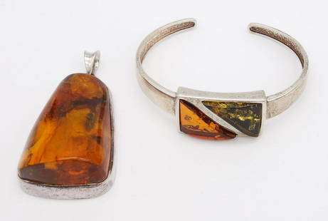 Vintage Sterling Silver Baltic Amber Necklace Pendant and Bracelet: This is a vintage lot of sterling silver Baltic Amber jewelry including a large pendant and cuff bracelet. The pendant is 2 3/8" long and the interior circumference is 6" plus a 3/4" gap at the back.