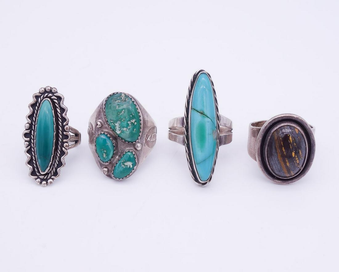 Vintage Lot 4 Native American Pawn Sterling Silver Rings incl Turquoise, Brown Stone: This is a vintage lot of 4 Native American pawn sterling silver rings featuring turquoise, and brown stone cabochon. The rings range is size from 5.25 to 10.5US. The lot weighs a total of 40g.