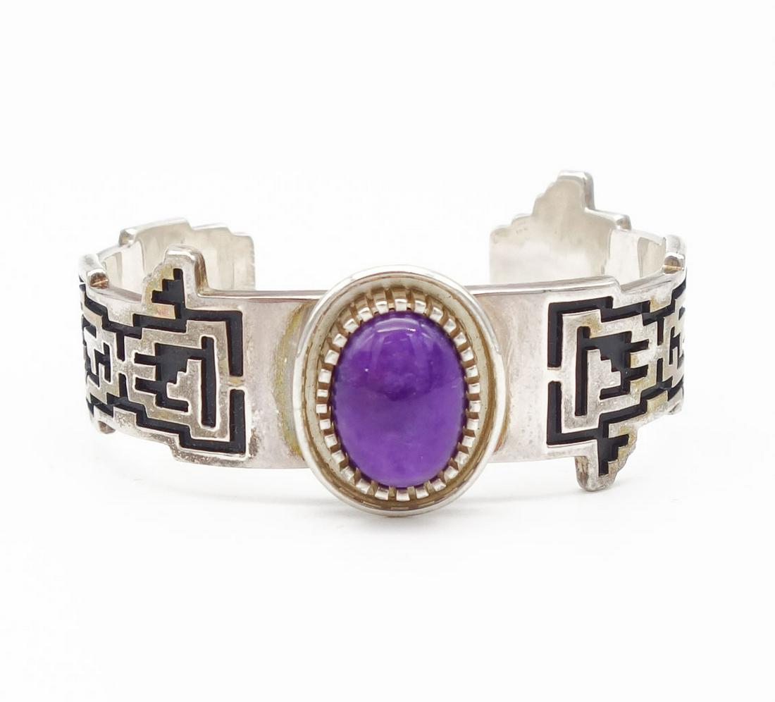 Native American Navajo Alvin Tso Sterling Silver Cuff: This is a vintage Native American sterling silver cuff bracelet with a large sugilite stone at the center. Hand crafted by Navajo silversmith Alvin Tso. The interior circumference is 5 3/4" plus a 1"