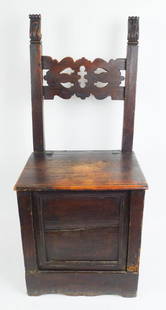 Antique Italian School Hinged Seat Wooden Carved Chair: This is an antique Italian School wooden chair with carved details and rose head nails. The hinged seat lifts to reveal a large storage compartment. 42 x 16 1/2 x 18 1/2" W. To the top of the seat,