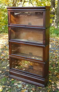 Antique 4 Stack Oak Barrister Bookcase: This is an antique oak and glass front four stack barrister bookcase dating to the early 20th century. 62 1/4" H x 34" W x 11" Max Depth