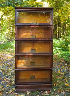 Antique 5 Stack Oak Barrister Bookcase: This is an antique oak and glass front five stack barrister bookcase dating to the early 20th century. 75" H x 34" W x 11" Max Depth