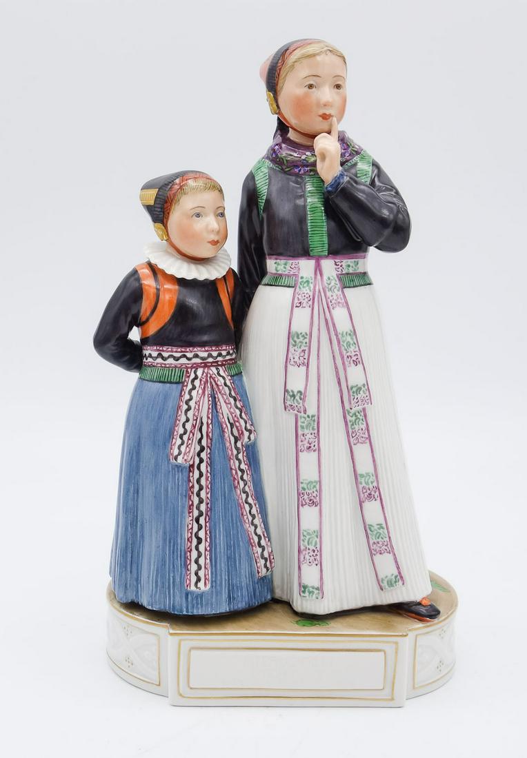 Royal Copenhagen Carl Martin-Hansen Amager Girls No. 12105: This is a vintage overglaze porcelain figurine designed by Carl Martin-Hansen (Danish, 1877-1941) for Royal Copenhagen. The figure is numbered 12105 and features a two Amager girls in traditional dres