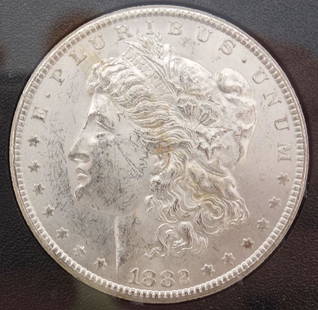 Uncirculated 1882-CC GSA Hoard Carson City Silver Dollar w Certificate: This is an uncirculated Carson City 1882 silver dollar. The coin comes in a plastic case labeled "CARSON CITY UNCIRCULATED SILVER DOLLAR." This is packaged in a box with a certificate detailing the hi