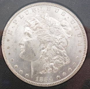 Uncirculated 1884-CC GSA Hoard Carson City Silver Dollar w Certificate: This is an uncirculated Carson City 1884 silver dollar. The coin comes in a plastic case labeled "CARSON CITY UNCIRCULATED SILVER DOLLAR." This is packaged in a box with a certificate detailing the