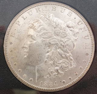 Uncirculated 1884-CC GSA Hoard Carson City Silver Dollar w Certificate: This is an uncirculated Carson City 1884 silver dollar. The coin comes in a plastic case labeled "CARSON CITY UNCIRCULATED SILVER DOLLAR." This is packaged in a box with a certificate detailing the