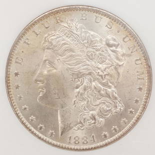 NGC Certified 1884-O $1 Silver Morgan Dollar Coin MS65: This is a NGC certified slabbed 1884-O Morgan silver dollar graded as MS65. Numbered 355297-002. The slab is 3 1/4 x 2 3/8"