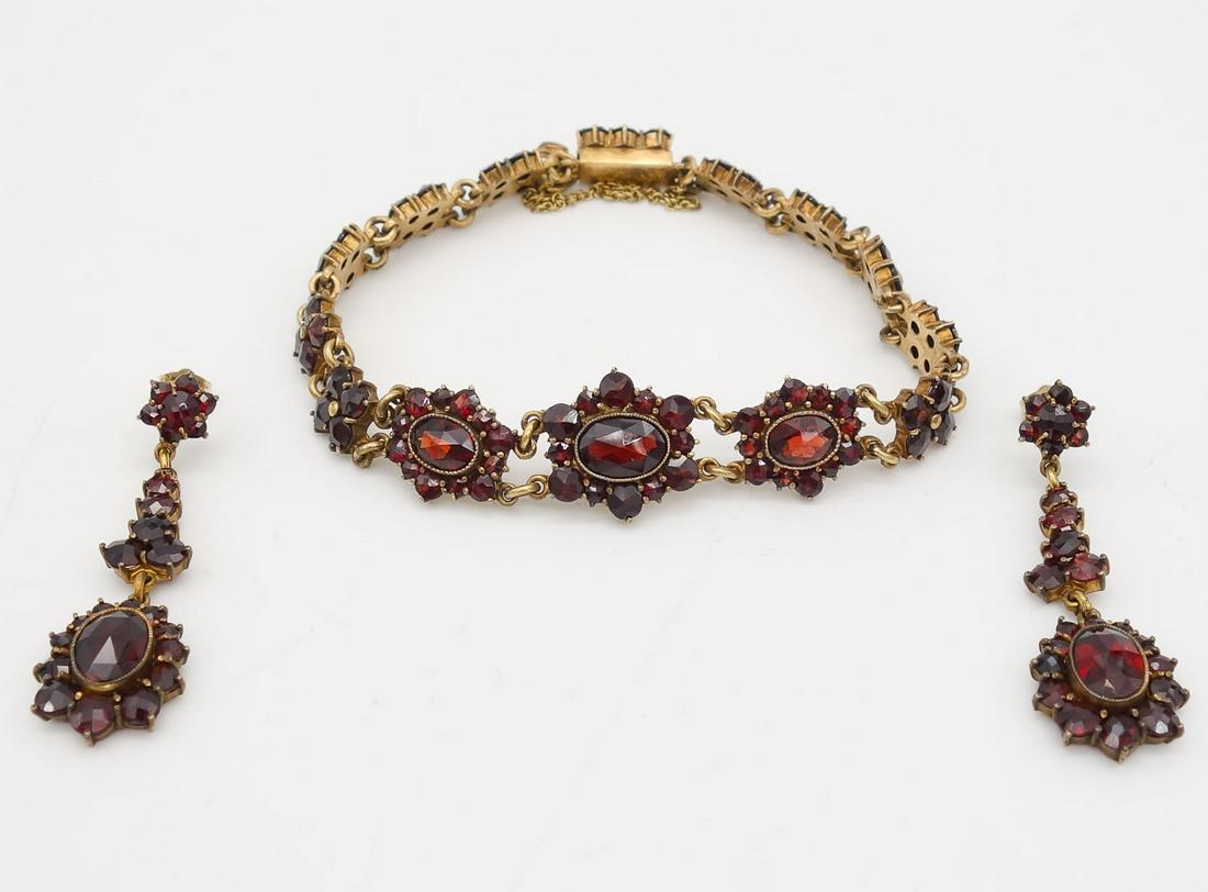 Antique Bohemian Garnet Dangle Earrings Bracelet Suite: This is an antique bracelet and dangle earrings suite featuring faceted Bohemian garnets. The earrings have 14K gold backing fasteners. The bracelet is 7" long x 5/8" max width. Each earring is 1 3/4"