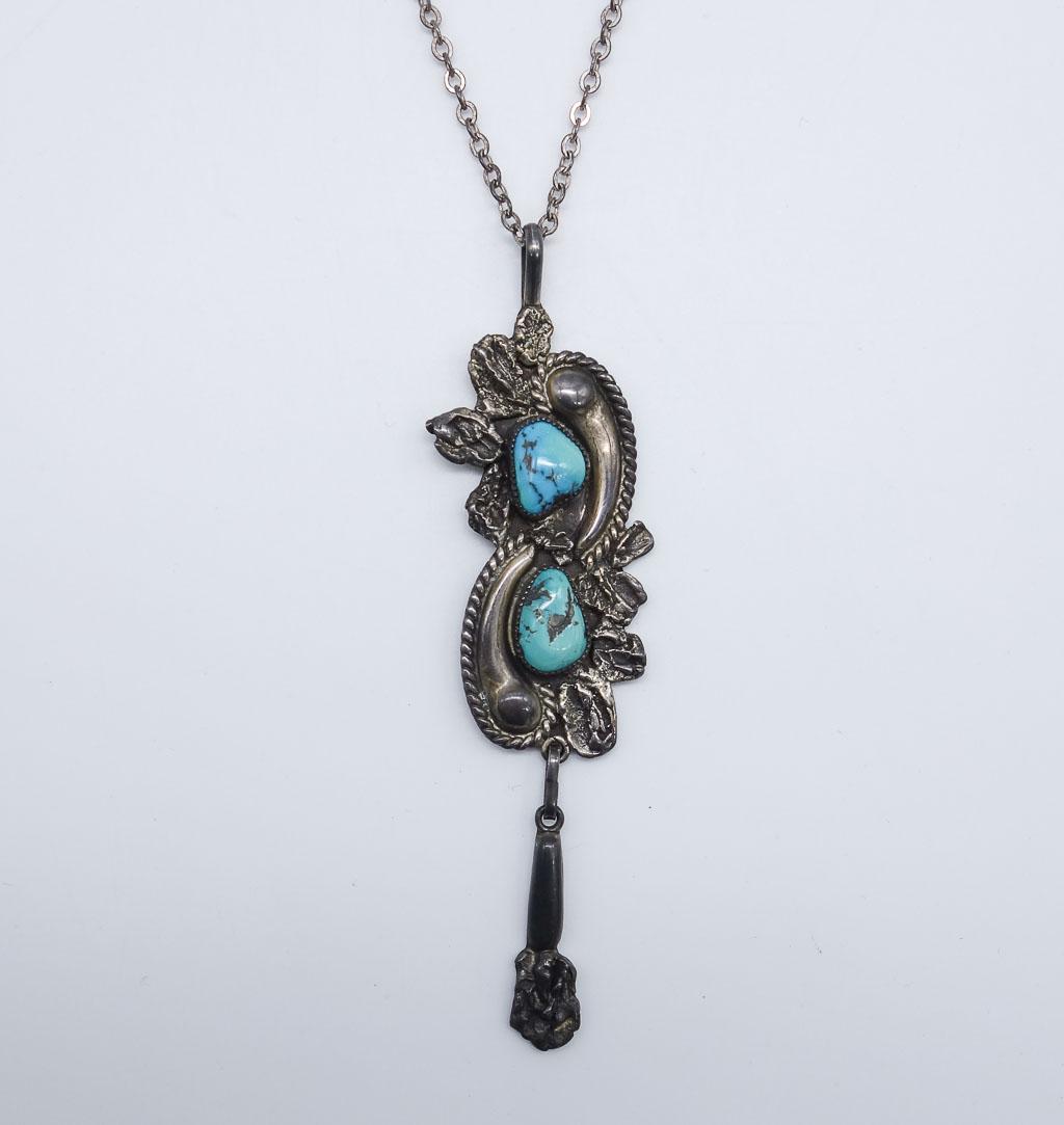 Vintage Native American Zuni Lee and Mary Weebothee Sterling Silver Turquoise Pendant Necklace: This is a vintage Native American sterling silver and turquoise pendant necklace made by Zuni craftsman Lee and Mary Weebothee. The chain is 22" long. The pendant is 4 1/4" long. It weighs a total of