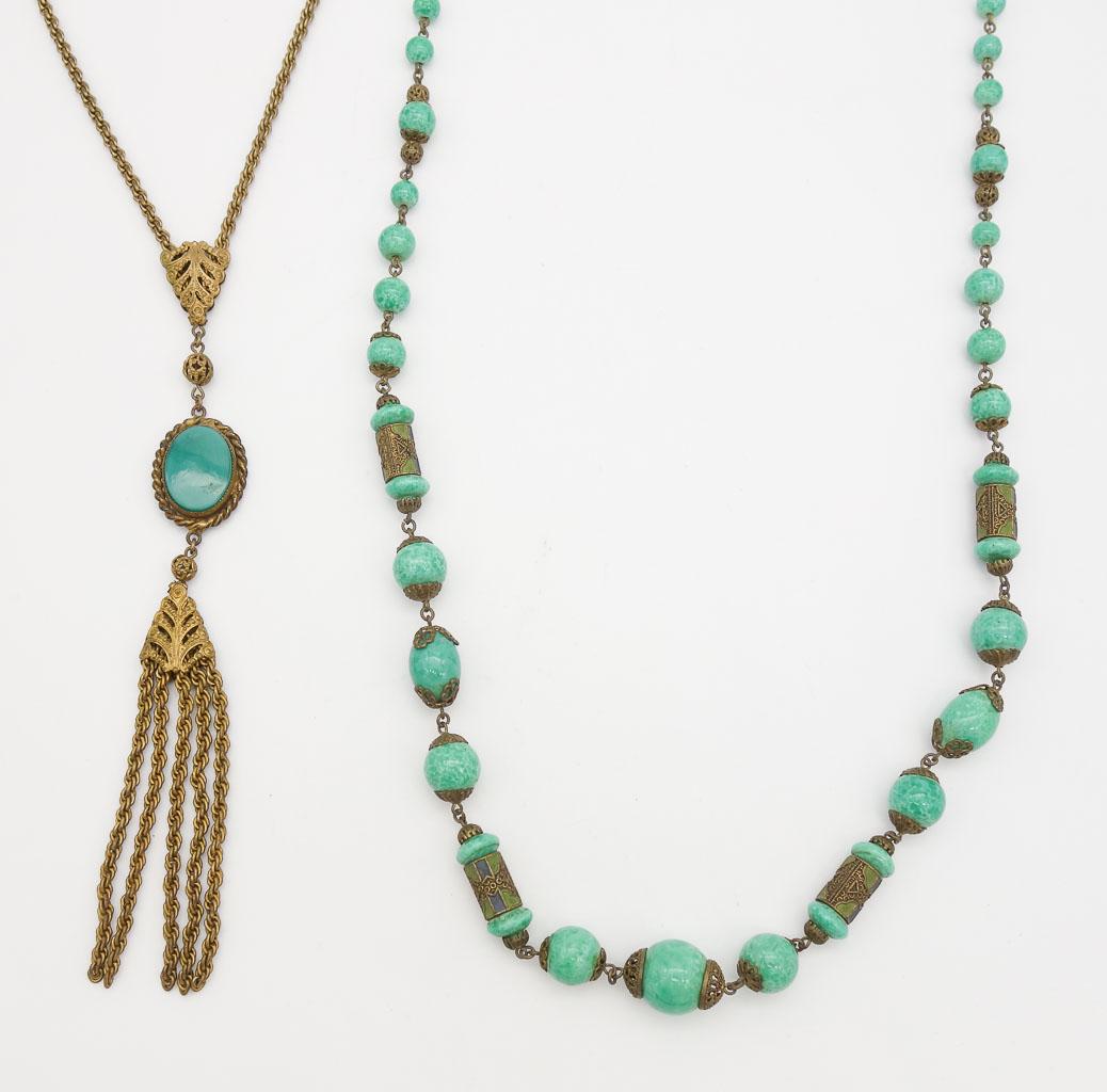 Antique c1910 Brass Filigree Green Bead Tassel Necklaces: This is an antique lot of two brass green bead necklaces dating to circa 1910. Includes fine filigree, enamel, and tassel details. The tassel necklace is 24" long and the other beaded necklace is 32"