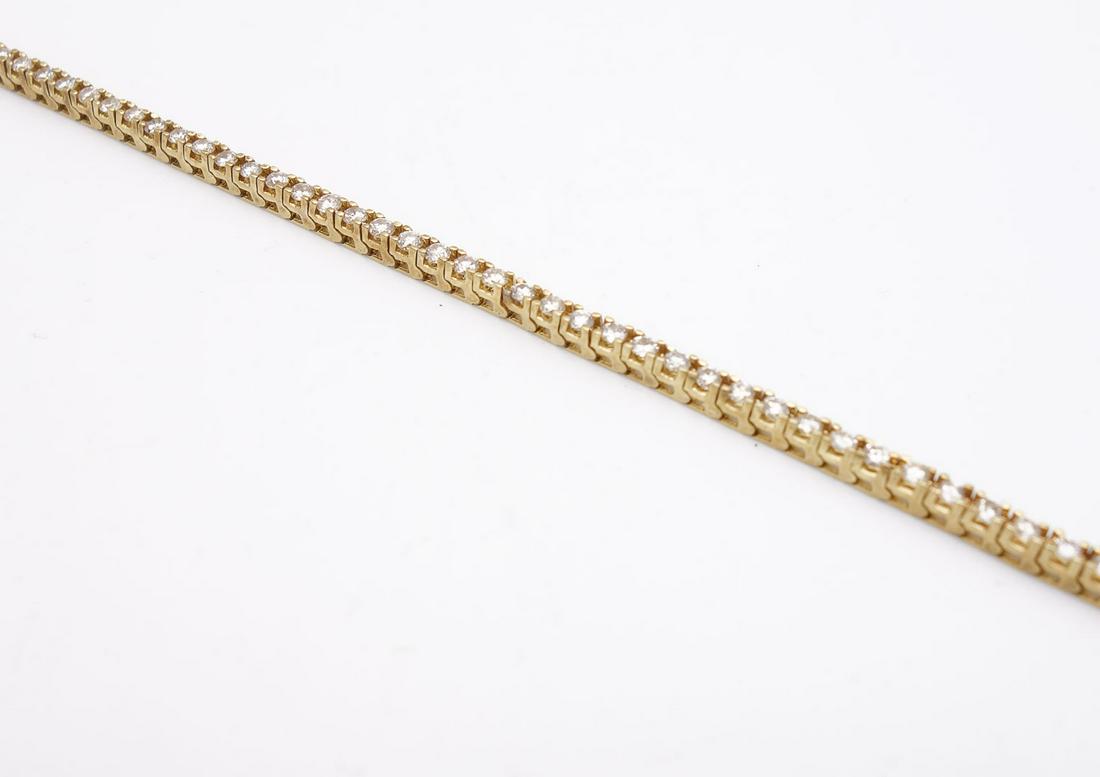Vintage 14K Gold 2+tcw Diamond Line Tennis Bracelet: This is a vintage 14K gold line tennis bracelet featuring 56 round brilliant cut diamonds (SI clarity/JK color). The bracelet is 7" long and it weighs a total of 10.9g. The total estimated carat weigh