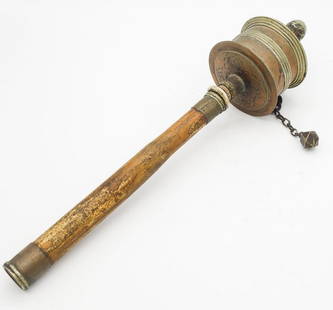 Engraved Brass Copper Tibetan Prayer Wheel: This is an antique wooden, brass, and copper handheld Tibetan prayer wheel. Engraved designs on the underside of the wheel. Contains rolls of paper mantras. From the Upstate New York estate of