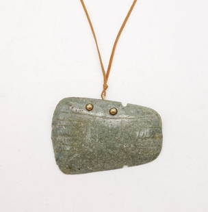 Carved Green Stone Axe Head Pendant, Gold Mounted: This is a carved green stone axe head pendant mounted on gold. Cord necklace. From the Upstate New York estate of Marshall and Kay Lee. Marshall was a well known collector of Pre-Columbian pottery