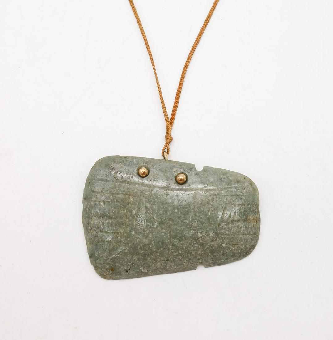 Carved Green Stone Axe Head Pendant, Gold Mounted Auction