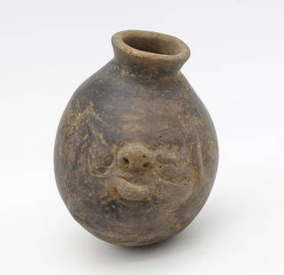 Pre-Columbian Costa Rican Pottery Vessel w Molded Face c. 800 A.D.: This is a Pre-Columbian Costa Rican pottery vessel with a molded face dating to circa 800 A.D. It was acquired from Arte Primitive, Inc on East 65th st in New York City in 1988. Accompanied by the rec