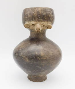 Pre-Columbian Ecuadorian Blackware Pottery Rounded Vessel w Molded Sheep Face C. 800-1500 A.D.: This is a Pre-Columbian Ecuadorian rounded blackware pottery vessel with a molded face (Sheep) decoration. Dating to circa 800-1500 A.D. Manabi in origin. This lot is accompanied by the original COA