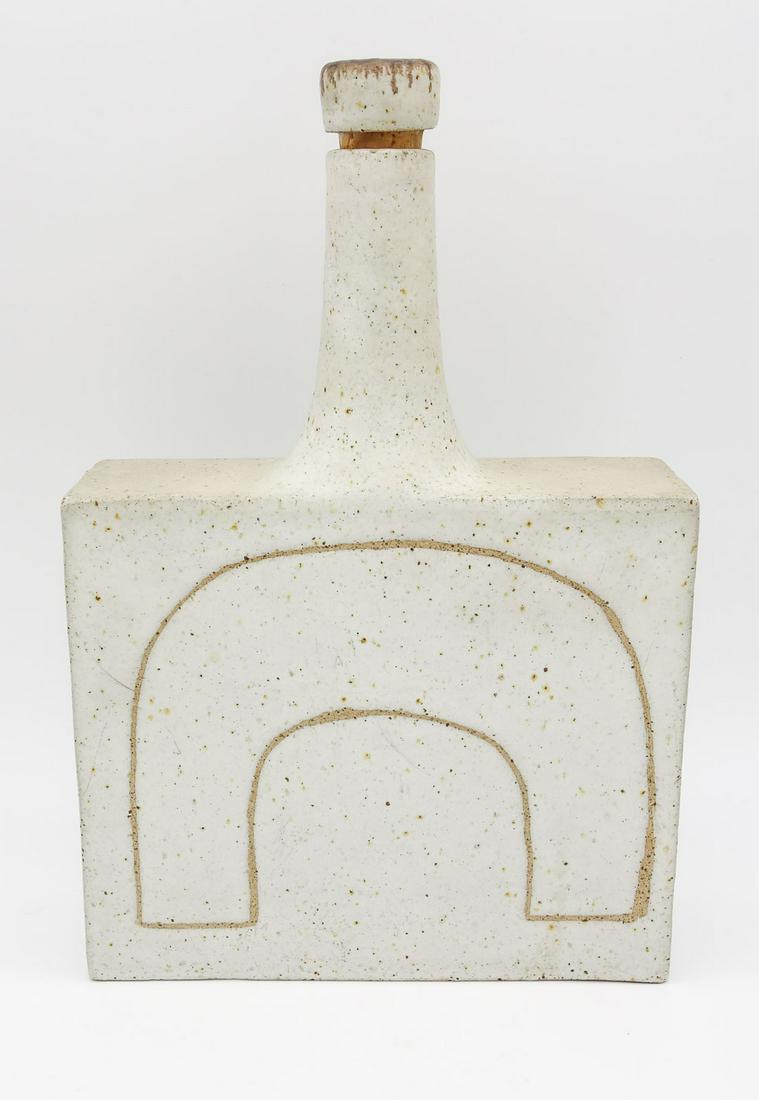 Italian Bruno Gambone Mid Century Modern Ceramic Bottle w Incised Arch: This is a Mid Century Modern large bottle form vase created by noted ceramicist Bruno Galbone (Italian, 1936-2021). The squared flask is incised with an arch motif. Signed on the underside. Gambone be