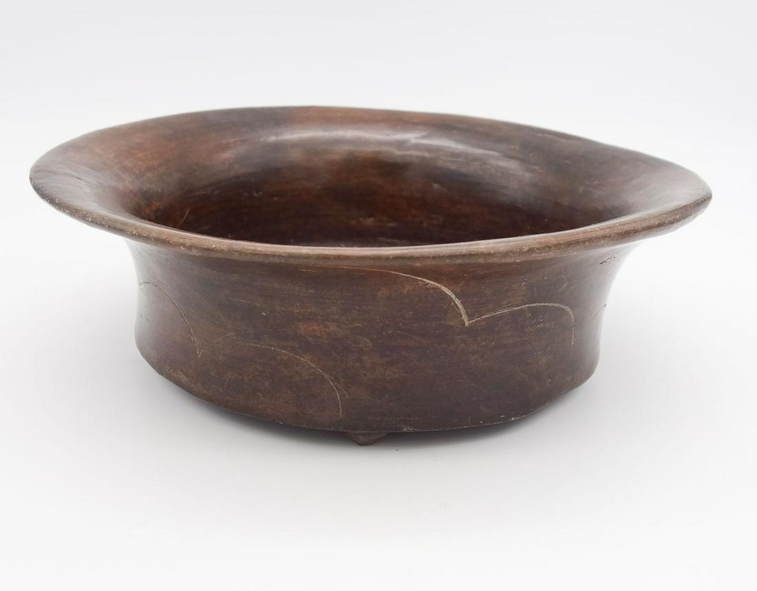 Pre-Columbian Early Classic Mayan Footed Cloud Incised Bowl 8 5/8": This is a Pre-Columbian Early Classic Mayan blackware pottery footed bowl with flared rim. It is incised with scalloped/clouds decoration. Dating to 250 A.D-600. From the Upstate New York estate of Ma