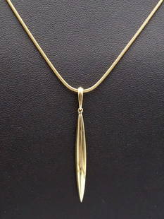 Vintage Tiffany 18K Gold Feather Pendant Necklace: This is a vintage Tiffany & Co 18K yellow gold feather pendant on a snake chain. The pendant is 1 7/8" long including the bale. The chain is 19" long. It weighs a total of 10.6g.