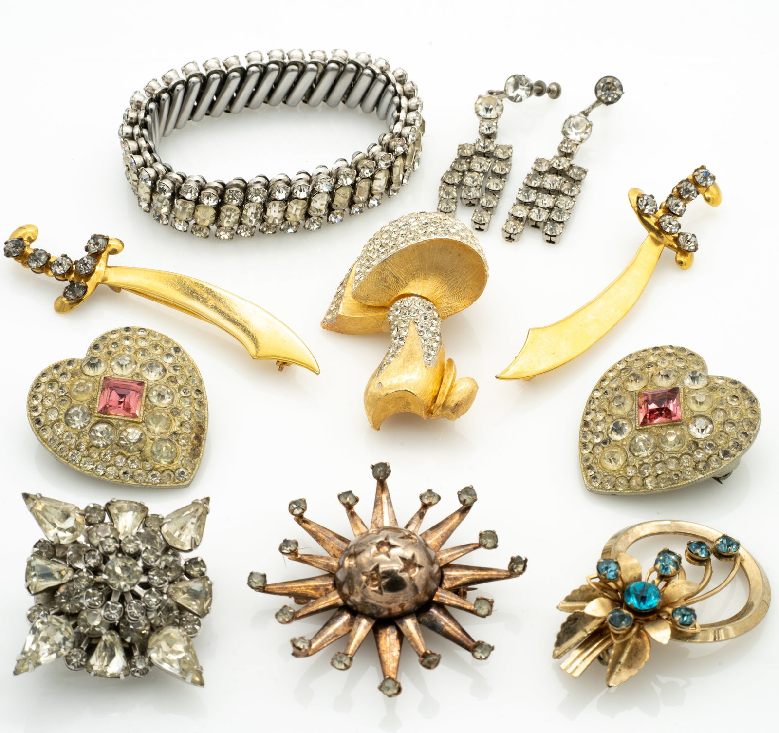 Group of Retro 1930-40's Rhinestone Jewelry: Lot 147 Group of Retro 1930-40's Rhinestone Jewelry Earrings (excluding screw backs): 1.55 x .5 x .19 in. Mushroom: 2.1 x 1.46 x .8 in. Bracelet Internal Circumference: 5.5 in. Heart (each): 1.47 x 1.
