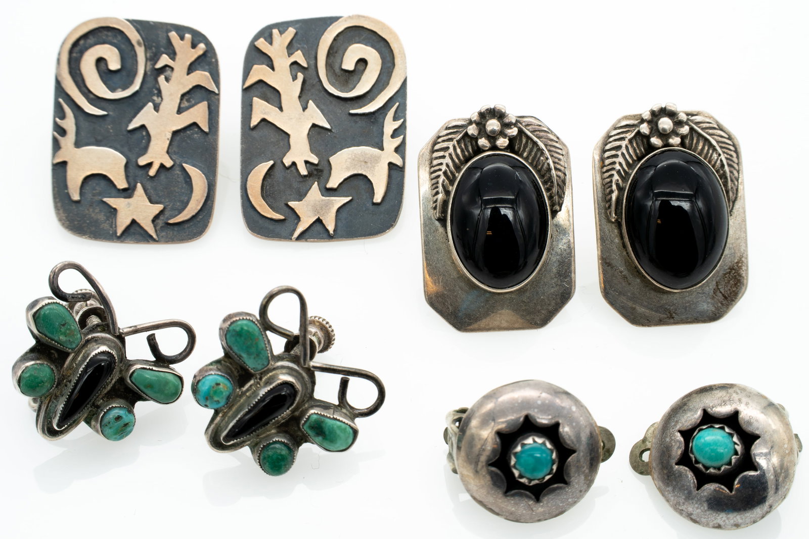 Lot of 4 Vintage Native American Turquoise Silver Earrings Pawn: Lot 232 Lot of 4 Vintage Native American Turquoise Silver Earrings Pawn Sterling Silver, Turquoise, Onyx Largest Pair (each excluding post): 1 x .7 x .06 in. Smallest (each): .56 x .63 x .57 in. 25.7