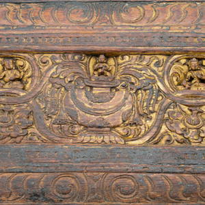 A Tibetan Painted and Carved Wooden Book Cover or Pecha Cover
