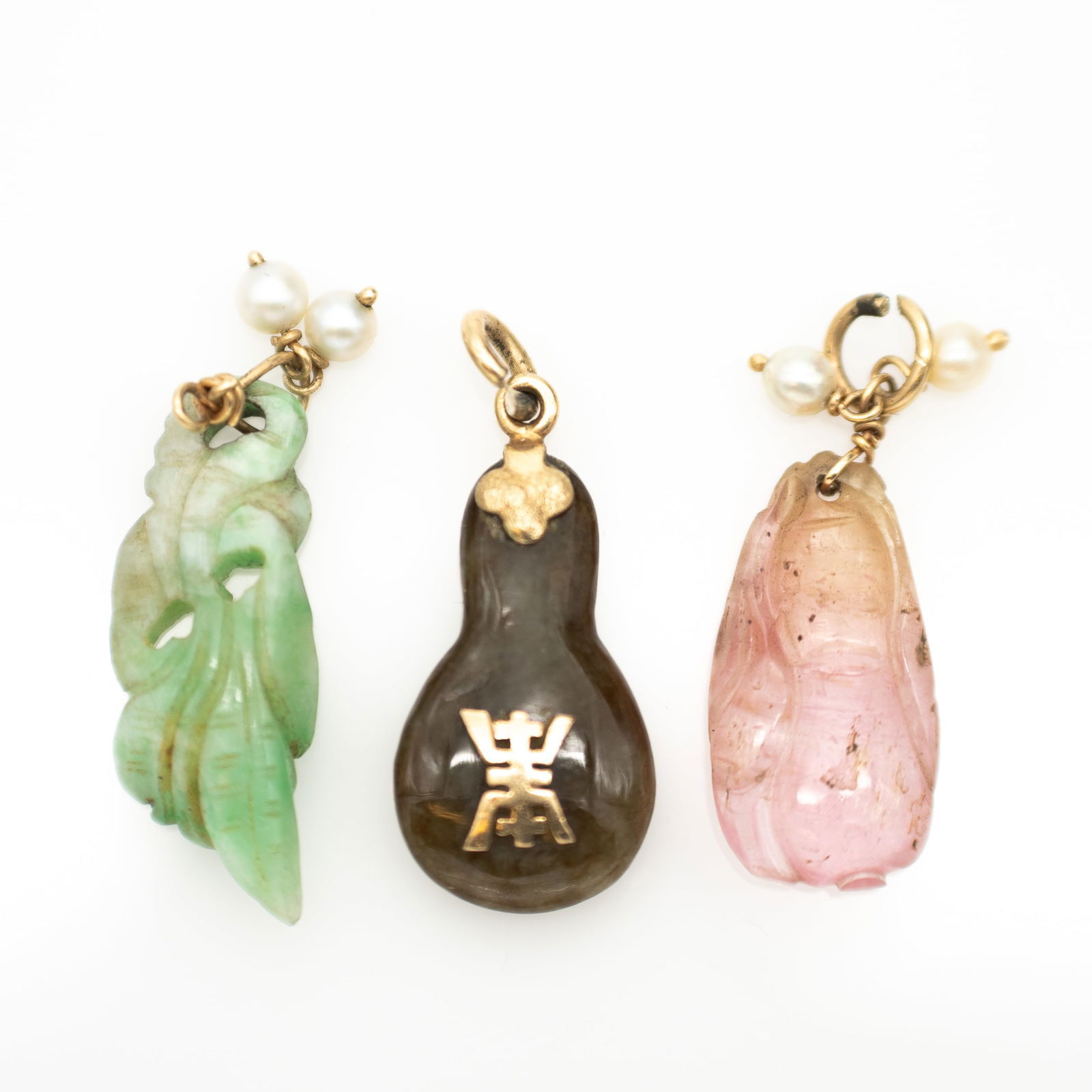 Lot of 3, Chinese 14k Gold Charms Jadeite, Nephrite, and Tourmaline: Lot 287 Lot of 3, Chinese 14k Gold Charms Jadeite, Nephrite, and Tourmaline 14k Gold, Jadeite, Nephrite, Tourmaline Jadeite: 28.6 x 9.6 x 5.8 mm Tourmaline: 23.3 x 12 x 5.25 mm Nephrite: 24 x 13.5 x 6