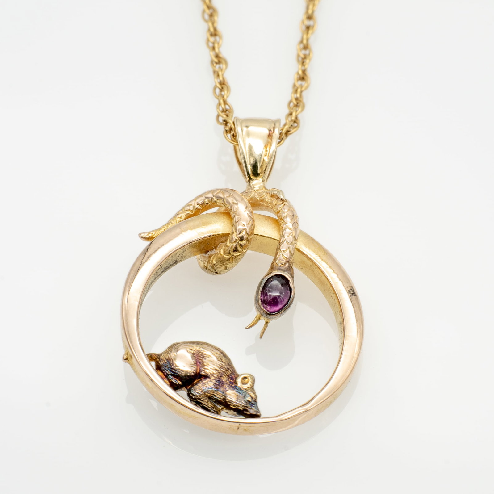 14k Gold Snake and Mouse Garnet Cabochon Pendant and Chain: Lot 303 14k Gold Snake and Mouse Garnet Cabochon Pendant and Chain Chain Stamped: [hallmark] / 14K Chain Length: 15.75 in. Pendant: .94 x .63 x .22 in. Stone: 2.7 x 2.2 mm 3.47 g