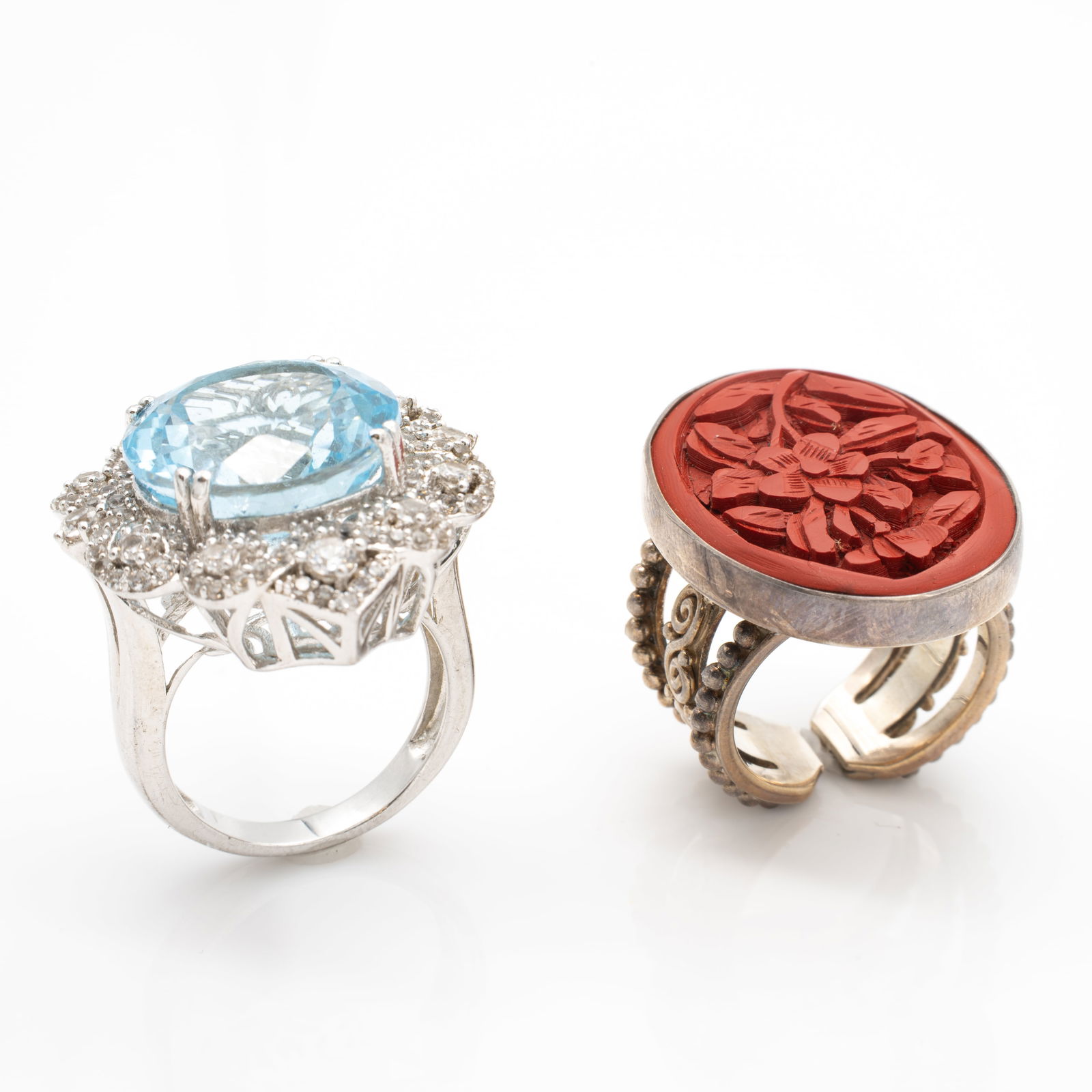 Lot of 2 Rings, Vintage Sterling Silver Orianne Blue Topaz Sajean Carved Cinnabar: Lot 35 Lot of 2 Rings, Vintage Sterling Silver Orianne Blue Topaz Sajean Carved Cinnabar Description: Blue Topaz Ring Stamped: Orianne / 925 Cinnabar Ring Stamped: sajen 925 Dimensions: Topaz Ring