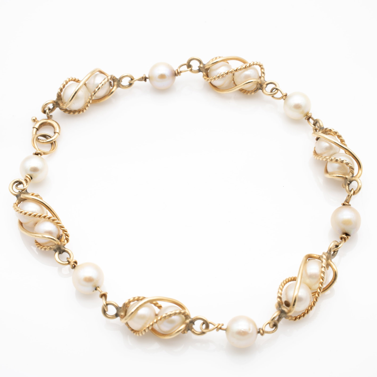 Vintage 14K Gold and Caged Pearls Bracelet: Lot 52 Vintage 14K Gold and Caged Pearls Bracelet Description: Claw Stamped 14K Dimensions: 7.5 in. Each Pearl: 5.5 mm Weight: 8.3 g