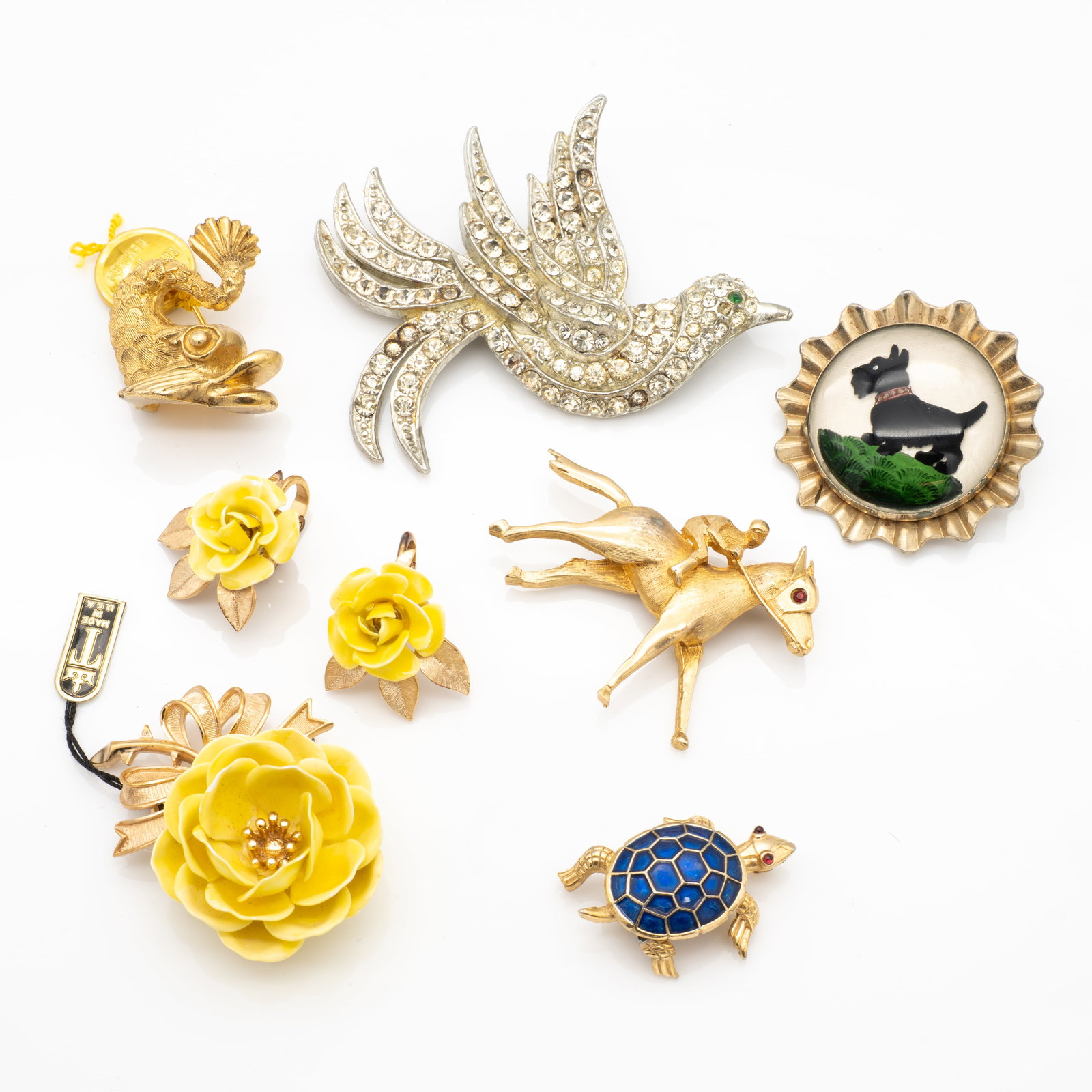 Vintage Mid-Century Costume Jewelry Lot, Trifari, Scotty Dog, Judith Green: Lot 80 Vintage Mid-Century Costume Jewelry Lot, Trifari, Scotty Dog, Judith Green Description: Turtle and Yellow Flowers Each Marked Verso: Trifari [copyright] Horse and Rider Marked: PELL [copyright]