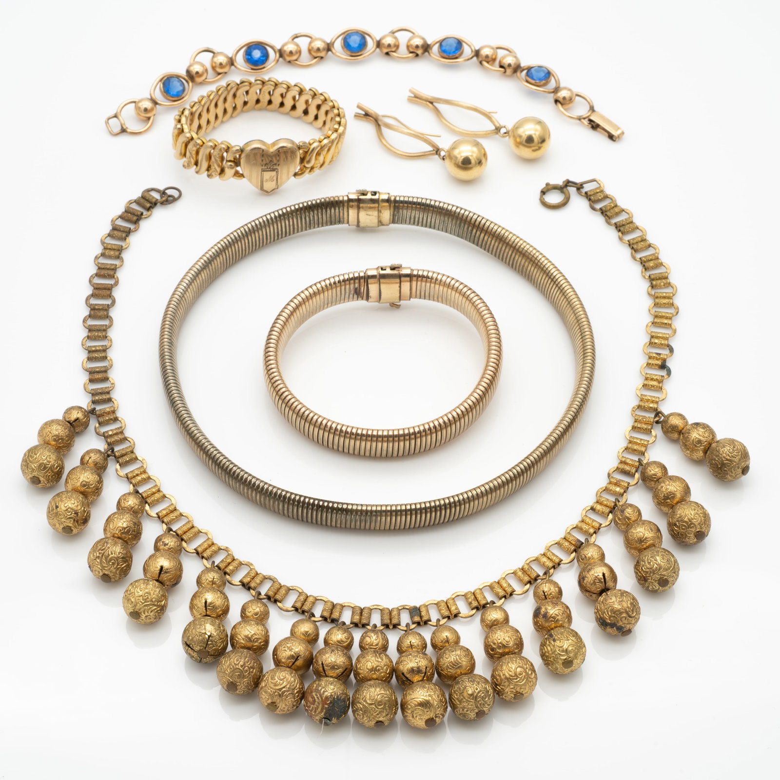 Lot of Antique Gold GF Jewelry Necklaces, Bracelets, and Earrings: Lot 83 Lot of Antique Gold GF Jewelry Necklaces, Bracelets, and Earrings Description: Heart Bracelet Stamped: AMERICAN QUEEN / AMERICAN QUEEN Other Bracelet and Matching Necklace Stamped: 1/20 12KT / 