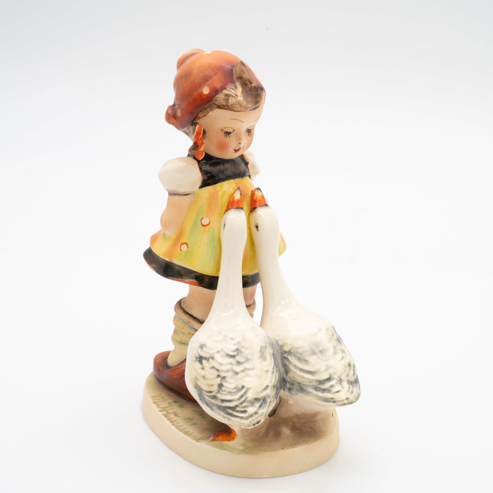 TMK 1 Goebel Hummel, 47/0 "Goose Girl": Lot 95 TMK 1 Goebel Hummel, 47/0 "Goose Girl" Dimensions: 5.2 x 4.3 x 2.5 in. Weight: 144.7 g