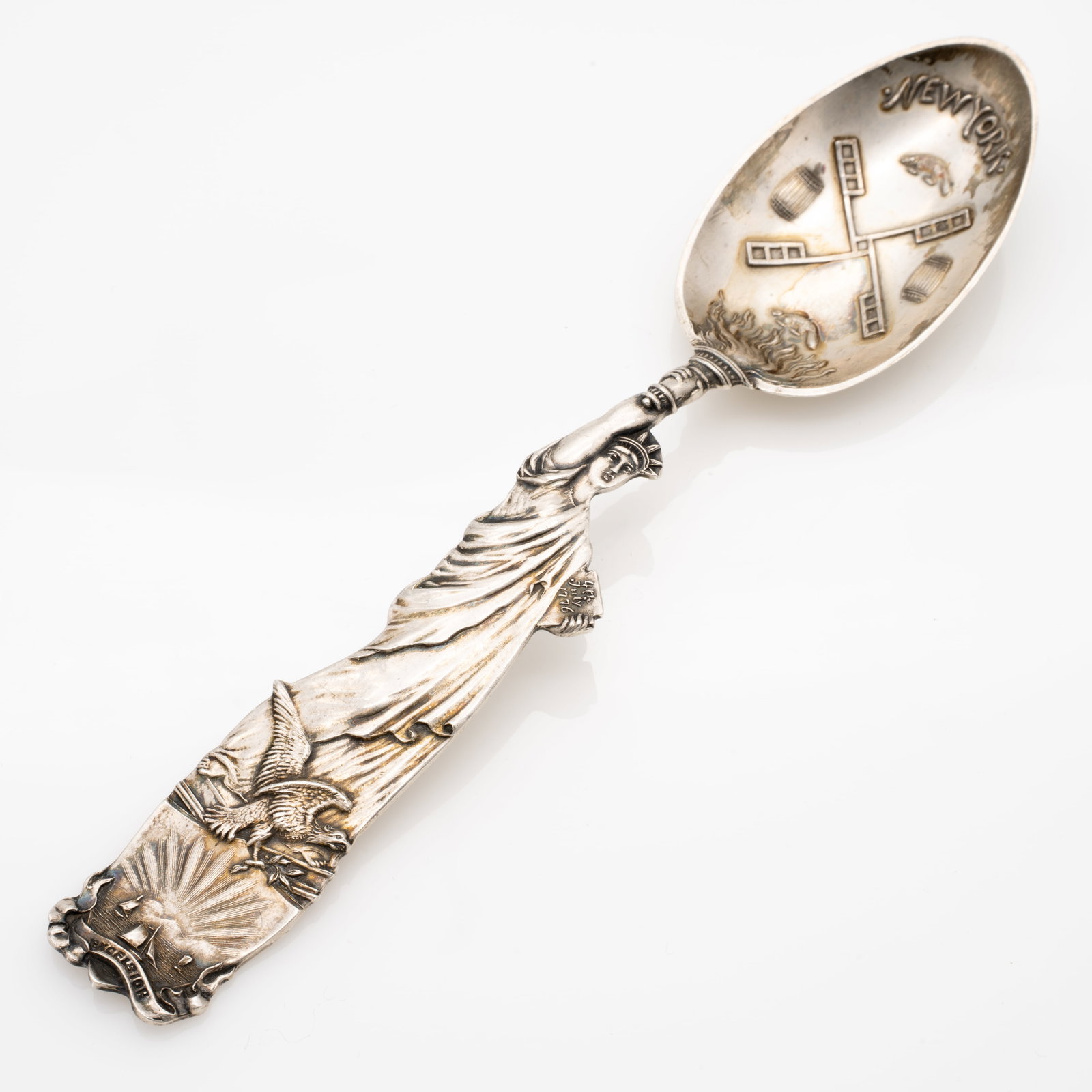 Full Figure Shiebler Sterling Silver Statue of Liberty Souvenir Spoon: Lot 239 Full Figure Shiebler Sterling Silver Statue of Liberty Souvenir Spoon Description: Stamped Verso: [Shiebler hallmark] STERLING PTD JULY 7.91 J.H.JOHNSTON[ampersand] CO. Dimensions: 5.77 x 1.21