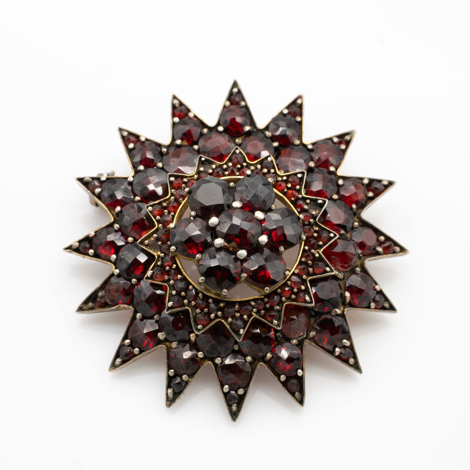 Large Gold Gp Bohemian Garnet Star Watch Pin Brooch: Lot 295 Large Gold Gp Bohemian Garnet Star Watch Pin Brooch Description: Unmarked. Material: Gold GP, Garnet Dimensions: 1.47 x 1.45 x .6 in. Weight: 8.1 g