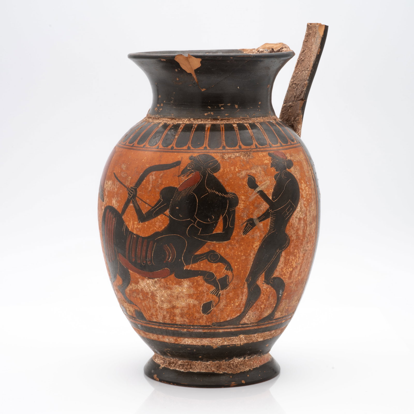 Greek Pottery Black-Figure Olpe Vase Depicting Centaur and Warriors: Lot 2 Greek Pottery Black-Figure Olpe Vase Depicting Centaur and Warriors Description: A Greek black-figure olpe (wine jug). This tall-bodied vessel is adorned with a narrative scene featuring a centa