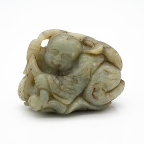 Carved Chinese Jade Group of Reclining Boy with Lotus Leaf