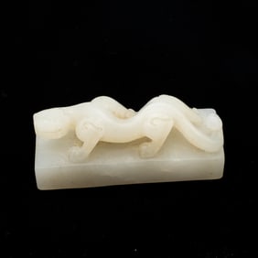 Carved Chinese White Jade Toggle of a Chilong of plinth