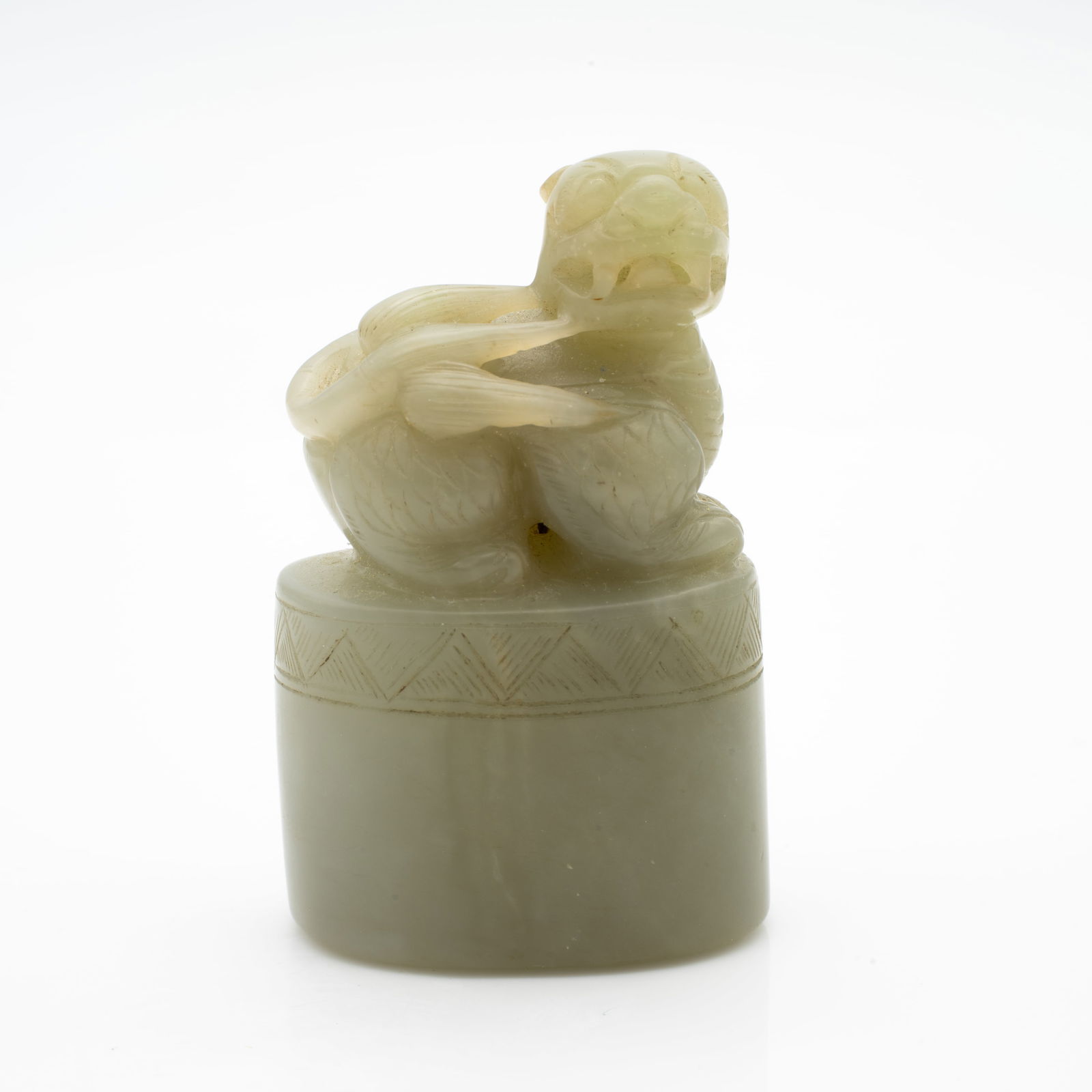 Carved Chinese Jade Seal with Mythical Beast Finial: Lot 118 Carved Chinese Jade Seal with Mythical Beast Finial Description: A cylindrical jade seal carved from soft celadon stone with a high polish and slight translucency. The top is surmounted by a d
