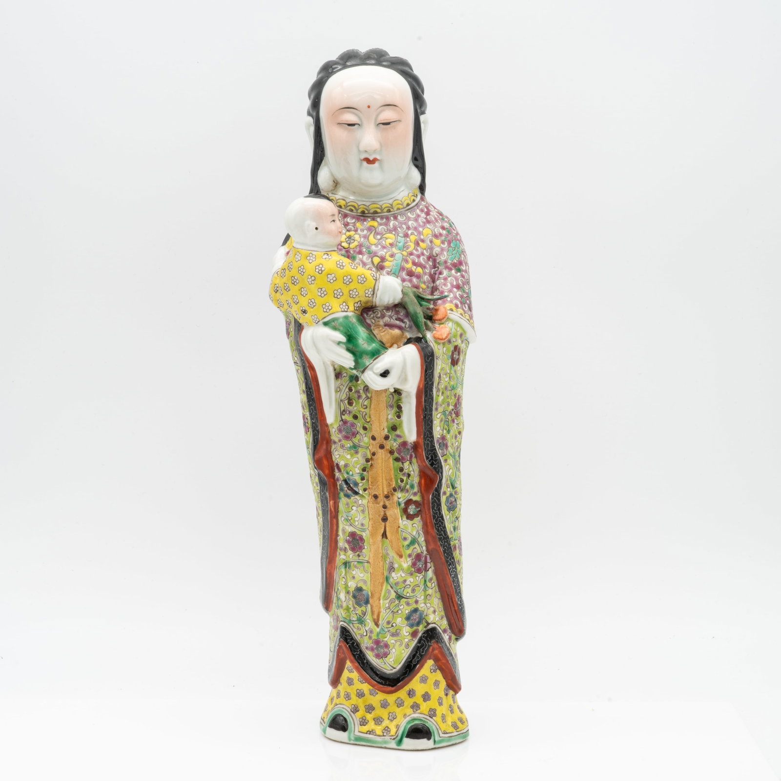 Chinese Famille Rose Porcelain Figure of a Mother and Child: Lot 148 Chinese Famille Rose Porcelain Figure of a Mother and Child Description: Modeled and painted porcelain figure of a standing woman holding a child, decorated in the famille rose palette with in