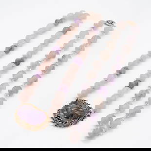 Pair of Carved Chinese Amethyst and Rose Quartz Necklaces: Lot 189 Pair of Carved Chinese Amethyst and Rose Quartz Necklaces  Description: A set of two vintage Chinese-style bead necklaces, composed of carved semiprecious stones and accented with precious met