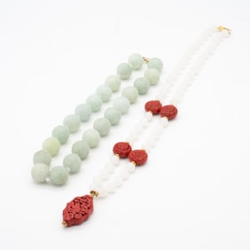 Pair of Chinese Necklaces Featuring 14K Gold, Carved Jade, and Cinnabar