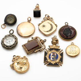 Group of 10 Antique Gold-Filled Charms and Fobs, Including Two Compasses