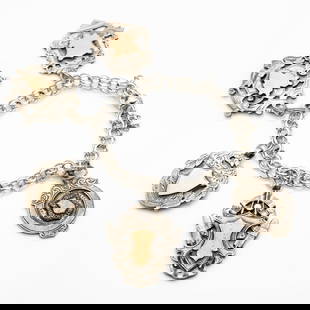 Antique English Sterling Silver Medallion Fob Charm Bracelet: Lot 225 Antique English Sterling Silver Medallion Fob Charm Bracelet Description: An antique English sterling silver charm bracelet featuring a collection of six ornate shield-shaped medallion fobs, e