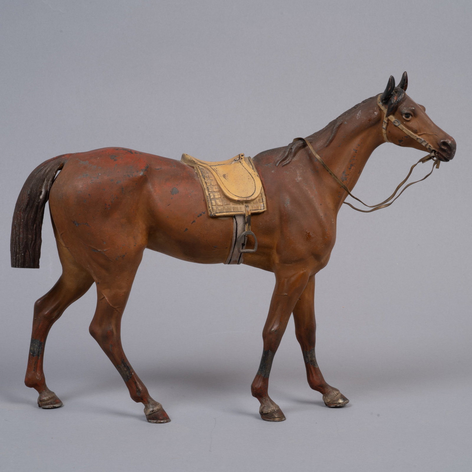 Cold-Painted Spelter Horse with Saddle and Bridle: Lot 251 Cold-Painted Spelter Horse with Saddle and Bridle Description: cold-painted spelter model of a horse, including a molded saddle. The figure is painted in reddish-brown with black highlights an