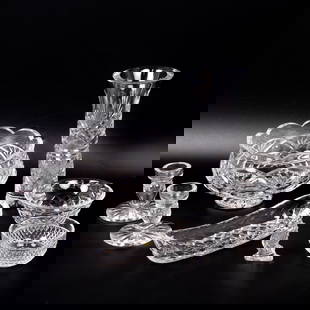 Group of 8 Waterford Cut Crystal Table Items: Lot 285 Group of 8 Waterford Cut Crystal Table Items Description: A group of 8 pieces of Waterford cut crystal, including: One tall flared vase with vertical and crisscross cut pattern One footed cent