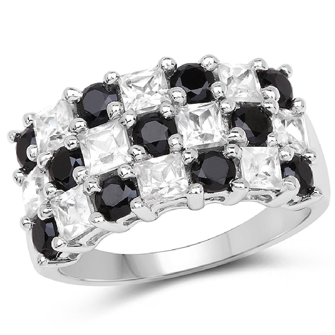 3.23 CTW Genuine White Topaz & Black Spinel .925: 3.23 CTW Genuine White Topaz & Black Spinel .925 Sterling Silver Ring Metal Type: .925 Sterling Silver Setting: Prong Item: Ring Finish: Rhodium Plated Total CTW: 3.23 Carat Length 10.53 MM <b